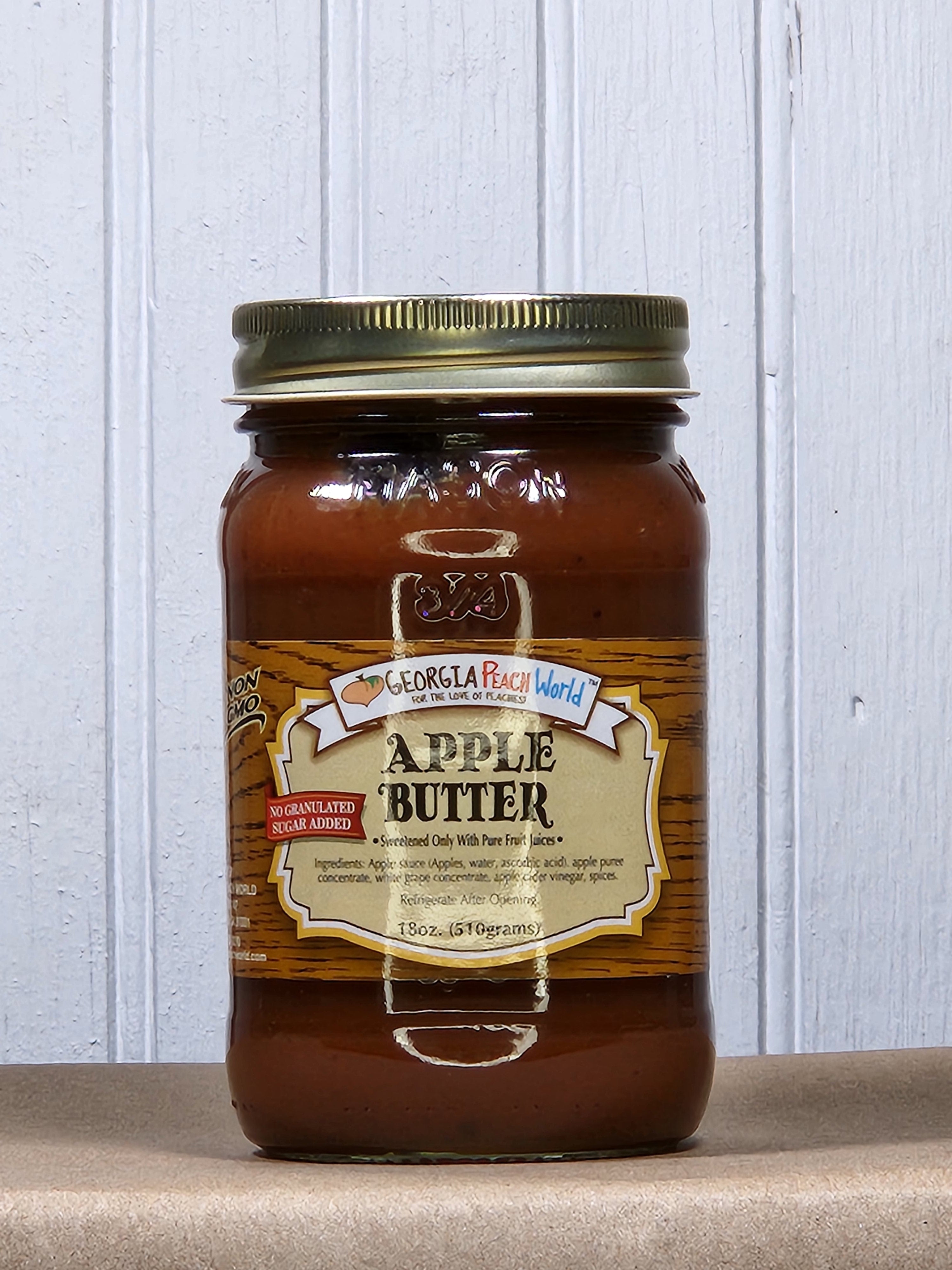 A jar of apple butter with a label that reads 'Apple Butter' and has some decorative elements like apple illustrations.