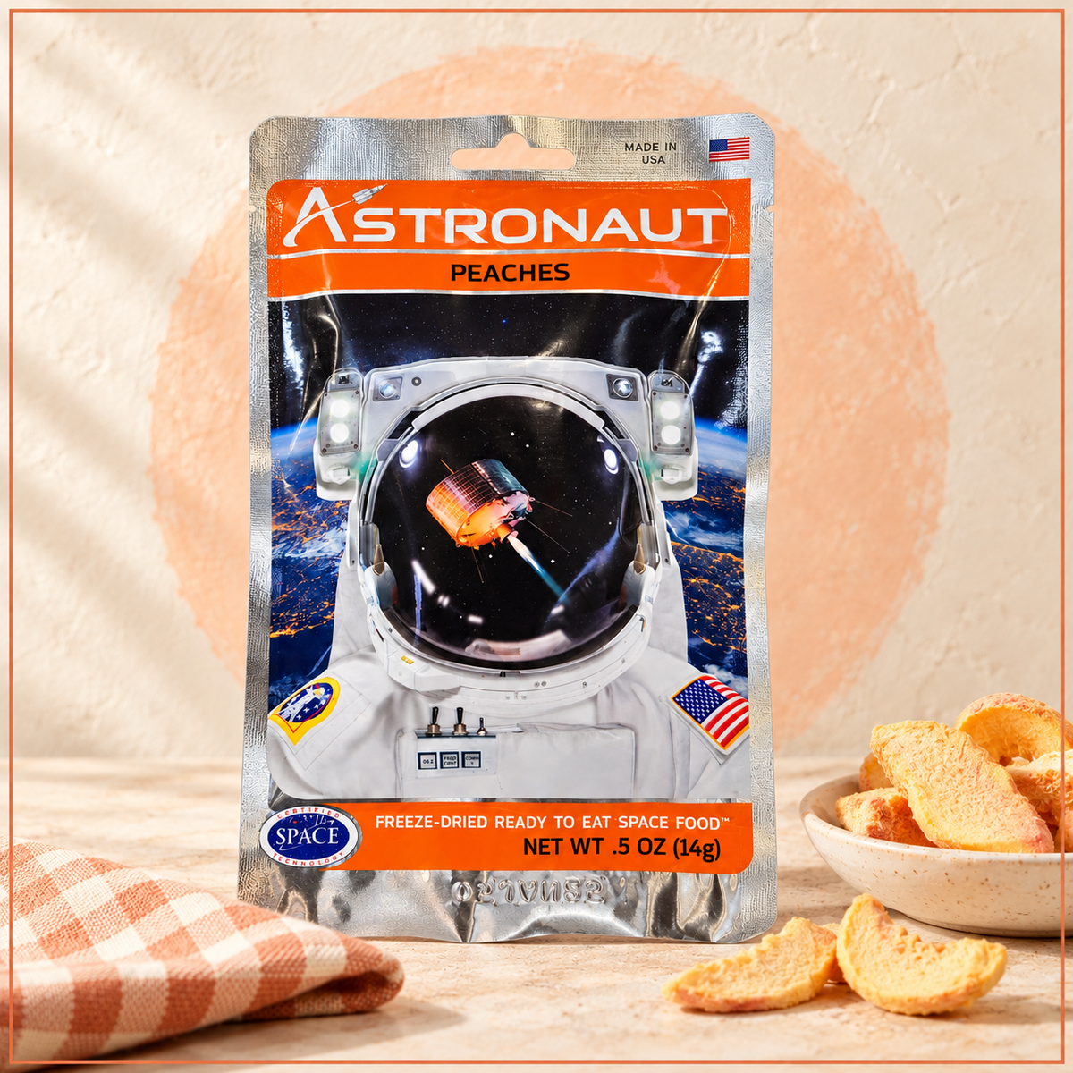Foil packaging with astronaut in space graphic containing .5 oz of freeze dried peach slices