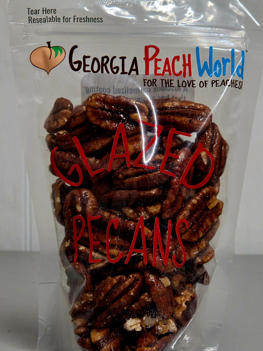 Packaged glazed pecans with 'Georgia Peach World' branding on a white background
