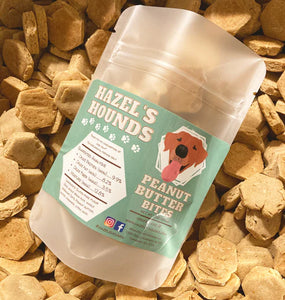 Frosted resealable plastic bag containing small bite sized hexagon shaped peanut butter dog treats