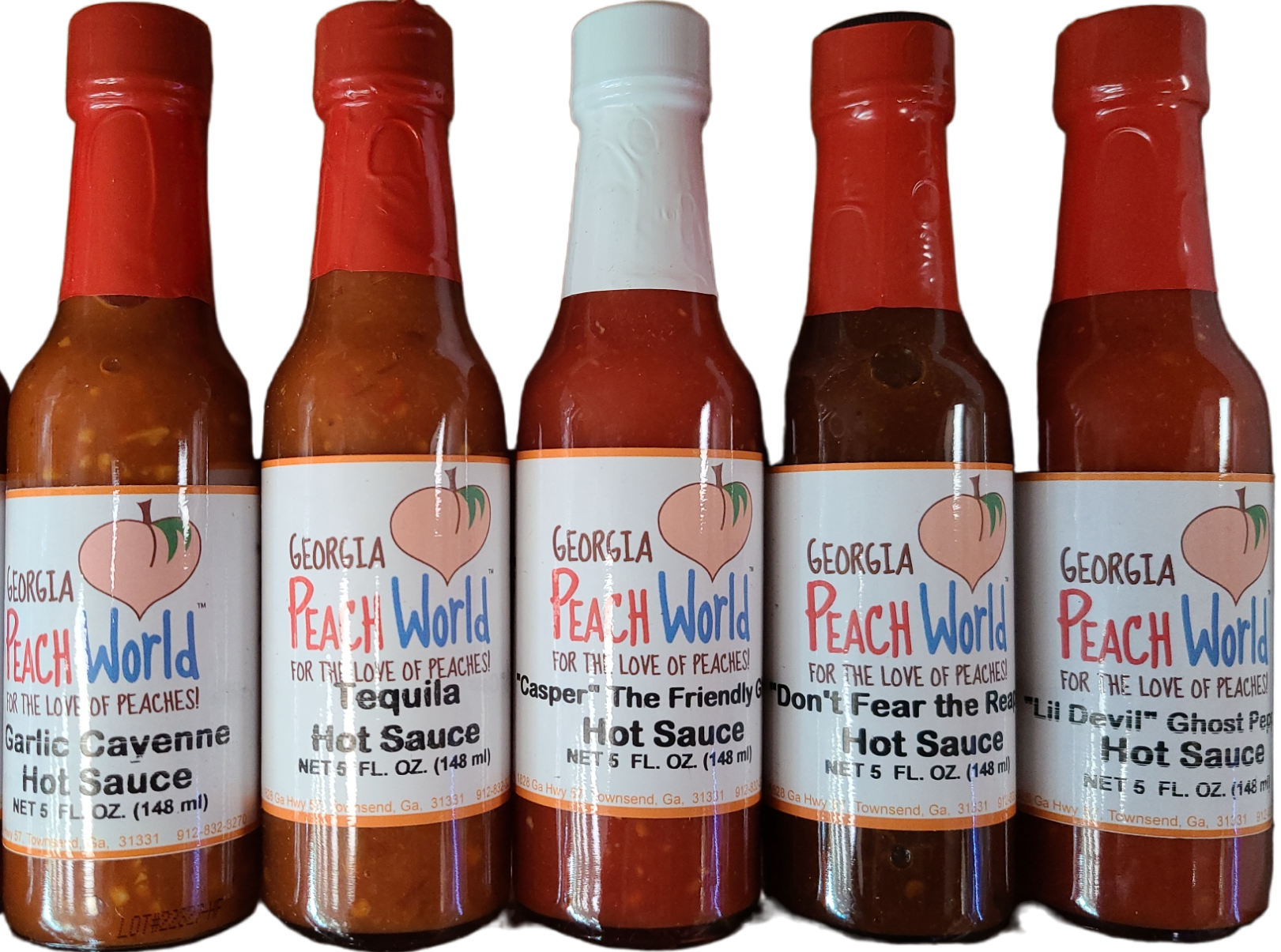 A variety of hot sauce bottles arranged side by side, with labels showing different brand names and flavors.