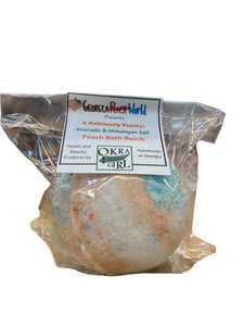 Plastic wrapped bath bomb with paper Okra girl branding label stapled on