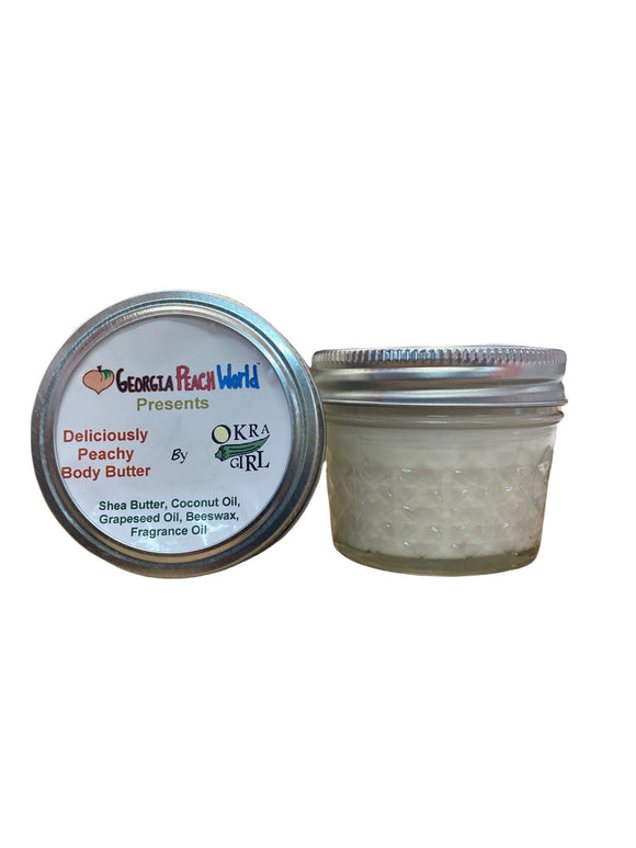 Small 2 oz ball canning jar containing peach scented body butter printed with Okra Girl's branding