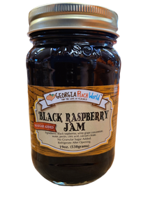 Standard glass Mason Jar containing Standard Mason Jar containing no sugar added black raspberry jam