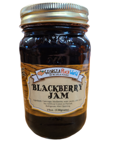 Standard glass Mason Jar containing Standard Mason Jar containing blackberry jam