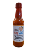 Small, tall glass 5 oz bottle containing butt burner hot sauce