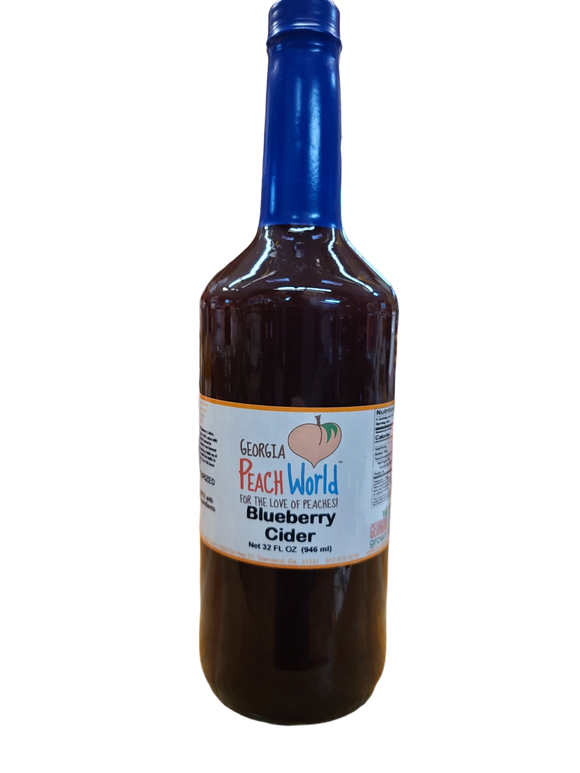 Tall glass quart sized bottle containing blueberry cider
