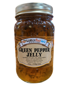 Standard glass mason jar containing green pepper jelly