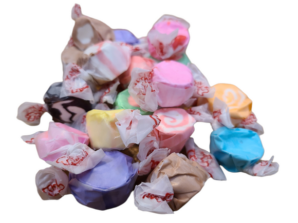 Assorted colored taffy wrapped in wax paper and packaged in plastic wrap