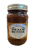Standard glass mason jar containing peach butter