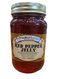 Standard glass mason jar containing red pepper jelly