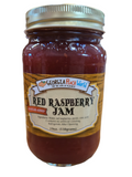 Standard glass mason jar containing no sugar added red raspberry jam
