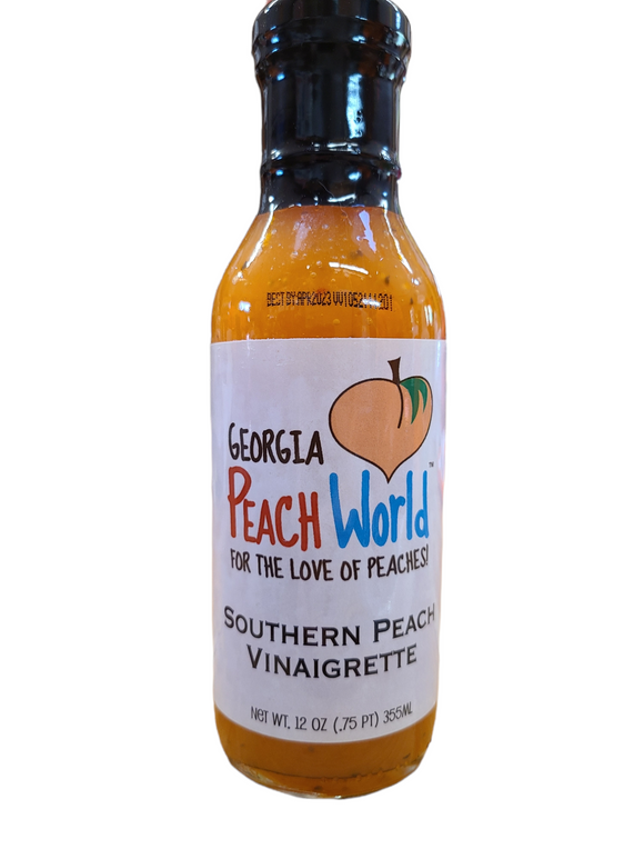 Tall 12 oz glass bottle with a shrink wrapped lid containing southern peach vinaigrette