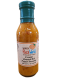 Tall 12 oz glass bottle with a shrink wrapped lid containing creamy roasted red pepper dressing