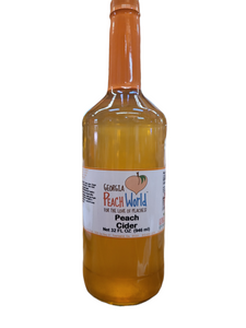 Tall quart sized glass bottle containing peach cider