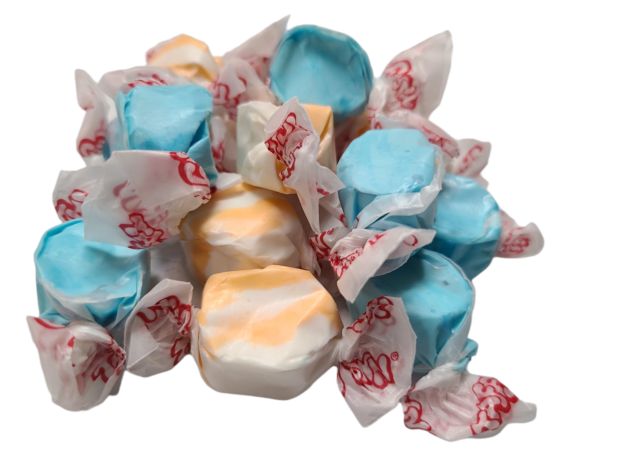 Orange and white swirled taffy wrapped in wax paper and a blue taffy wrapped in wax paper