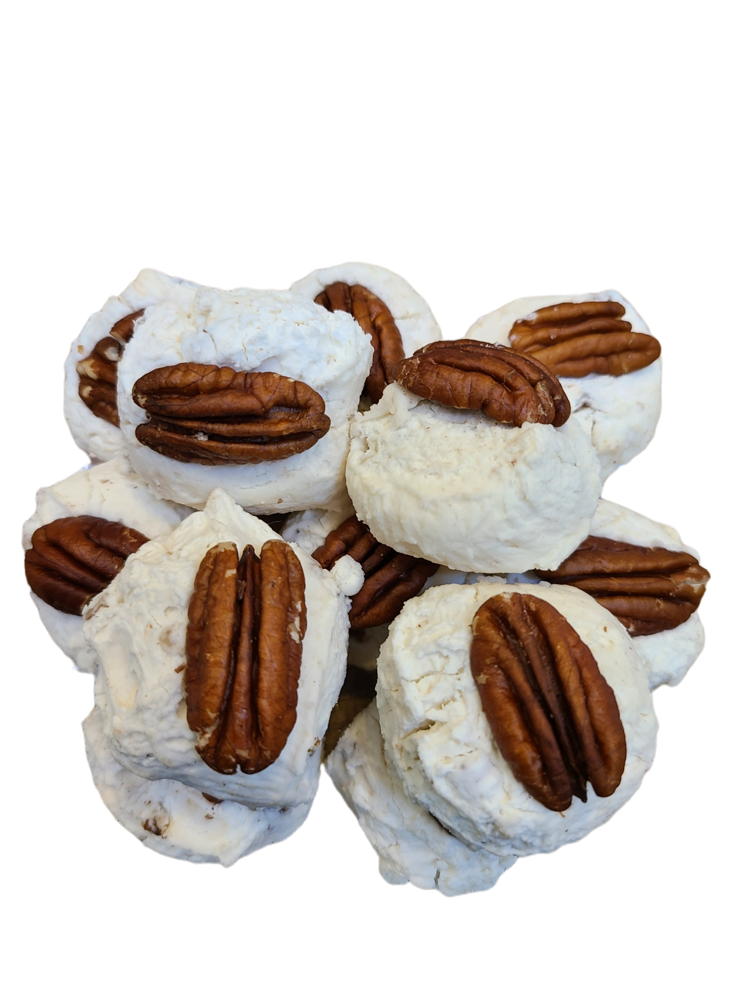 White fluffy nougat topped with a pecan half.