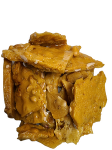 Plastic hinged clamshell package containing peanut brittle