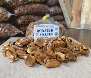 Plastic wrapped roasted and salted pecan halves and pieces