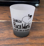 Standard frosted shot glass with a black bottom printed with Georgia Peach World branding